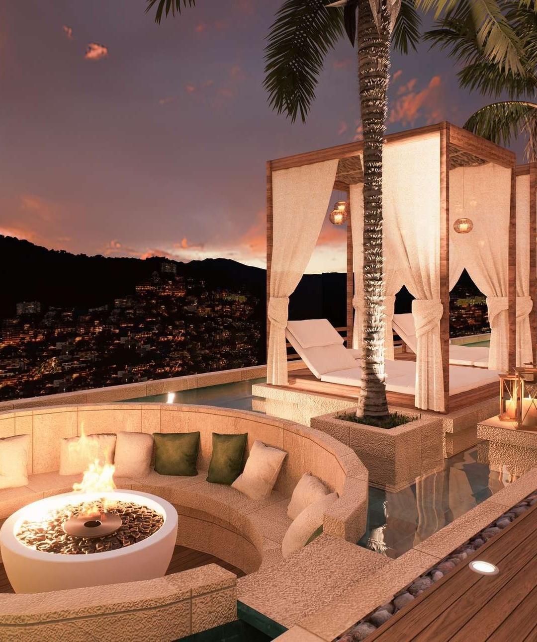 Rooftop cabana and fire pit at sunset